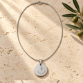 Women's Wealth and Protection necklace, front view with Wealth and Protection symbols