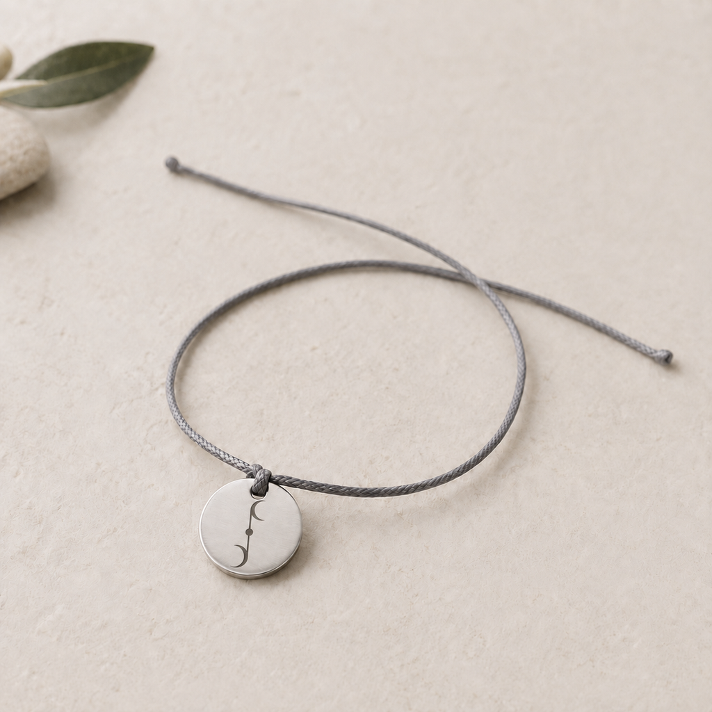 Joy bracelet, front view with Aleira Gana symbol engraving