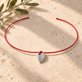 Happiness bracelet in silver with red cord, front view